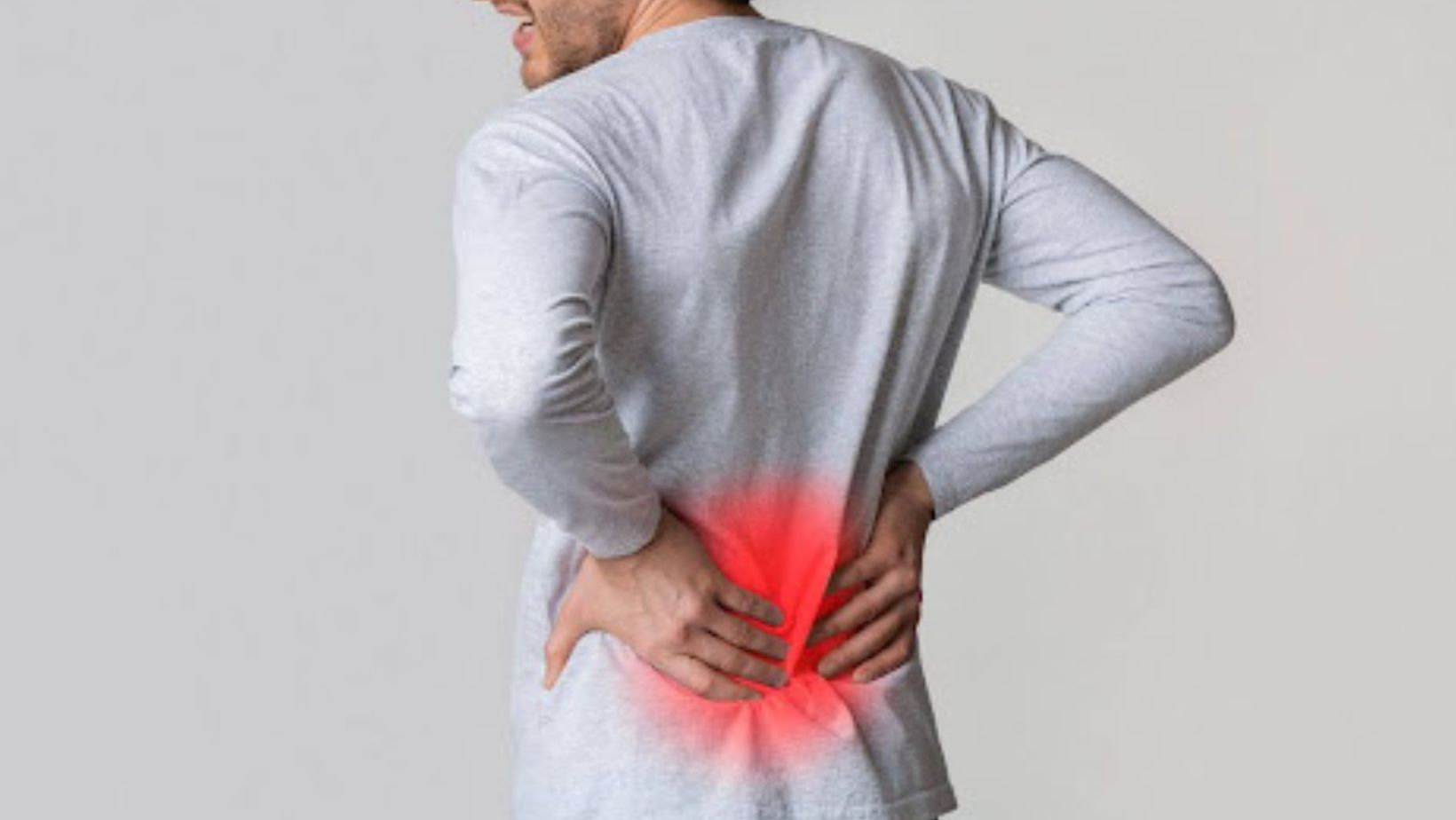 Person with back pain seeking relief from chronic discomfort 