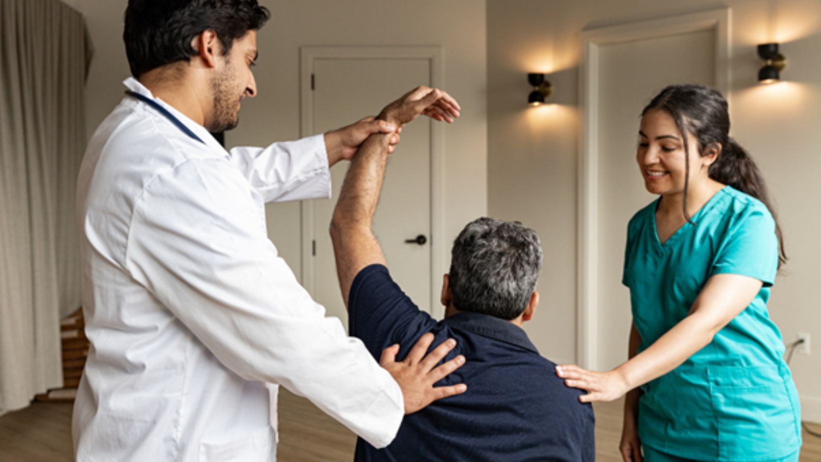 orthopaedic-clinic-team-supporting-patient-during-joint-mobility-assessment-and-physiotherapy