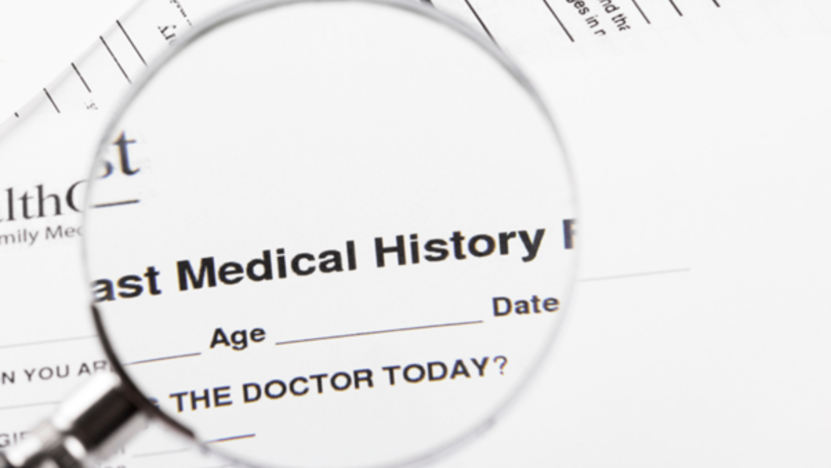 medical-history-form-under-magnifying-glass-used-to-prepare-patient-for-upcoming-allergy-test