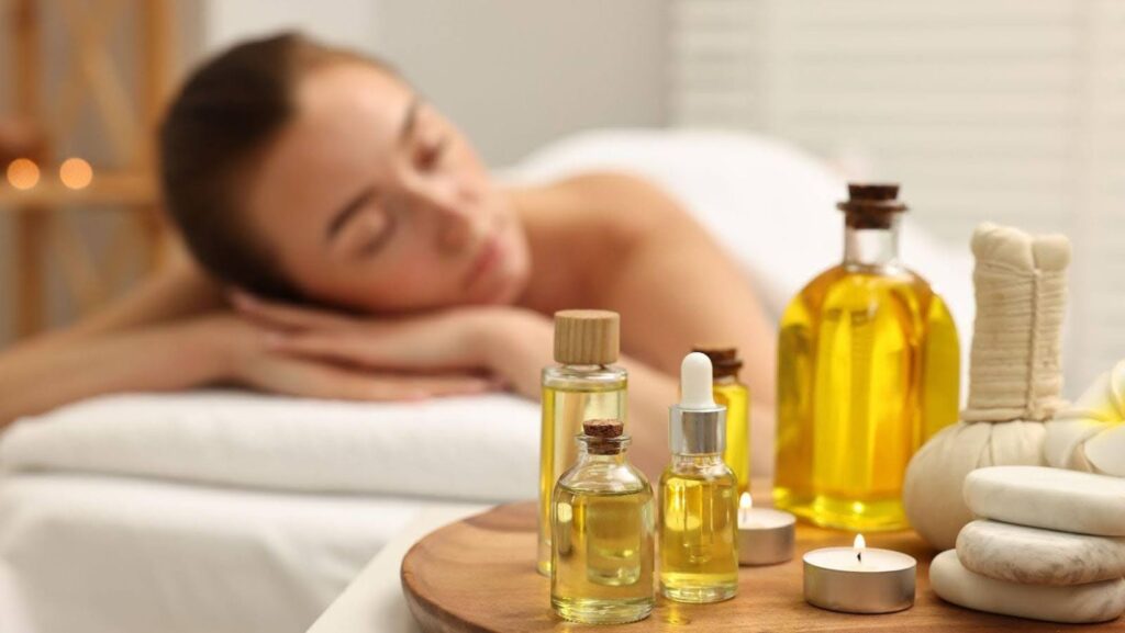 A woman using the best essential oils for ear infection while relaxing.